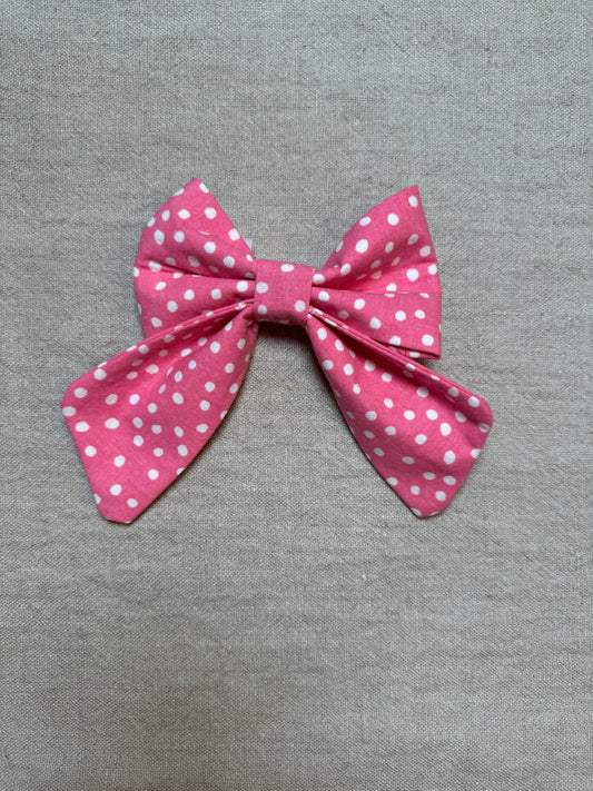 Pink and white polka dot bow