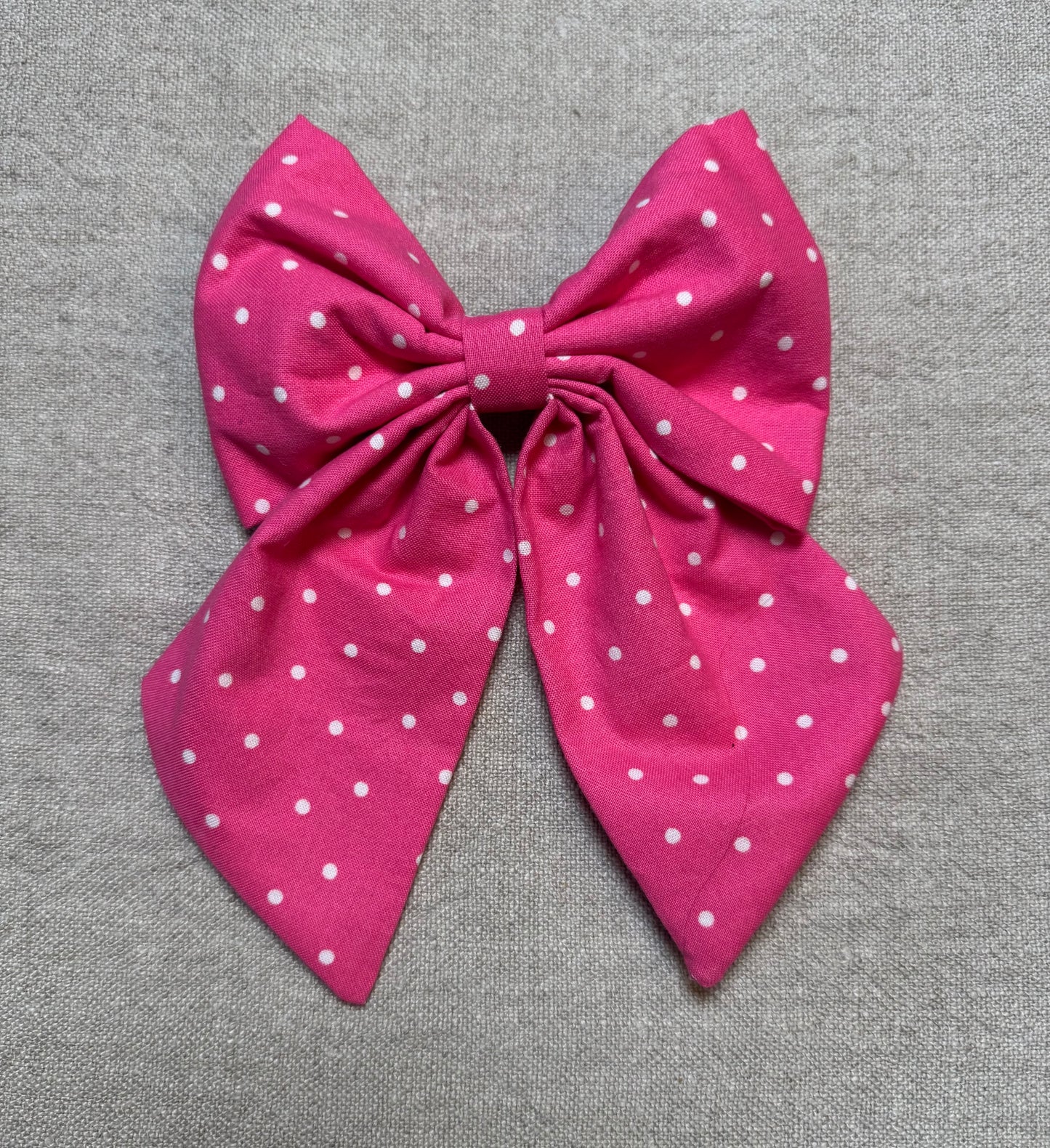 Pink and white polka dot bow
